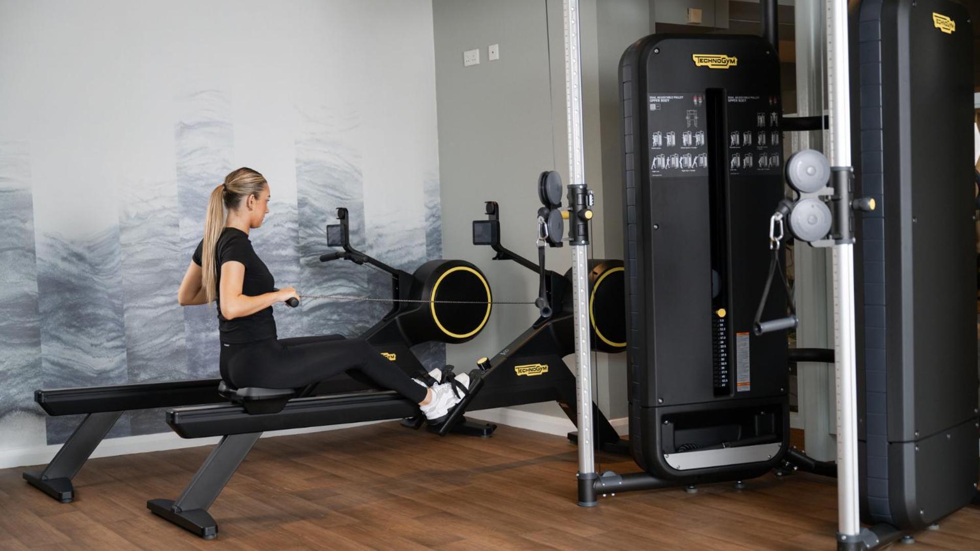 The Culloden Estate And Spa Holywood  Exterior photo A woman using a rowing machine